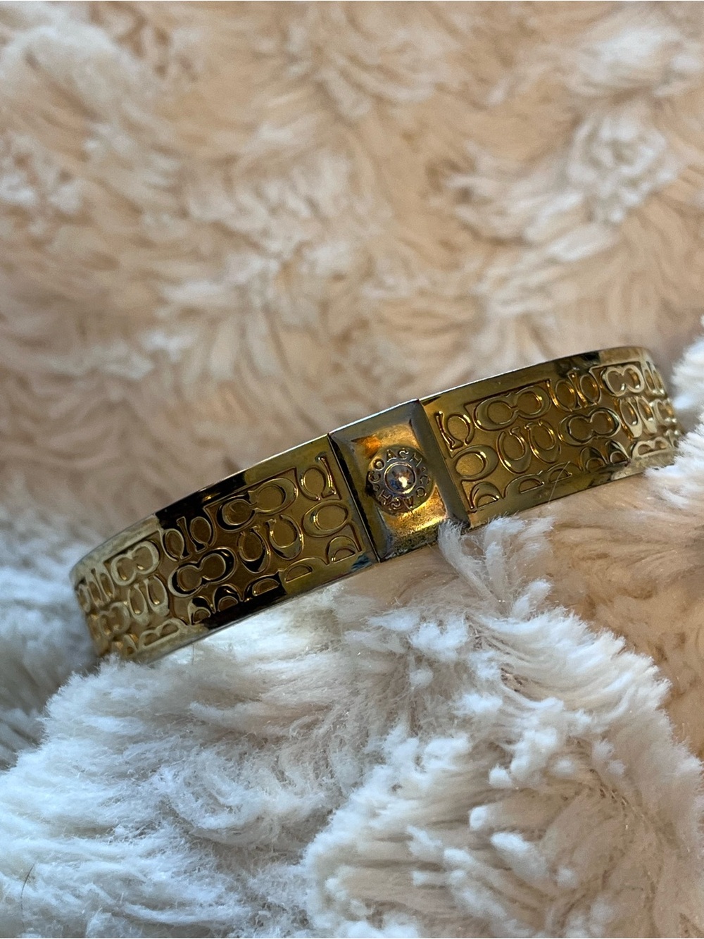 Coach Gold-Tone Signature Pattern Hinged Bangle Bracelet